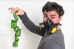78144549 - man with gas mask is holding stinky sock - unpleasant smell concept